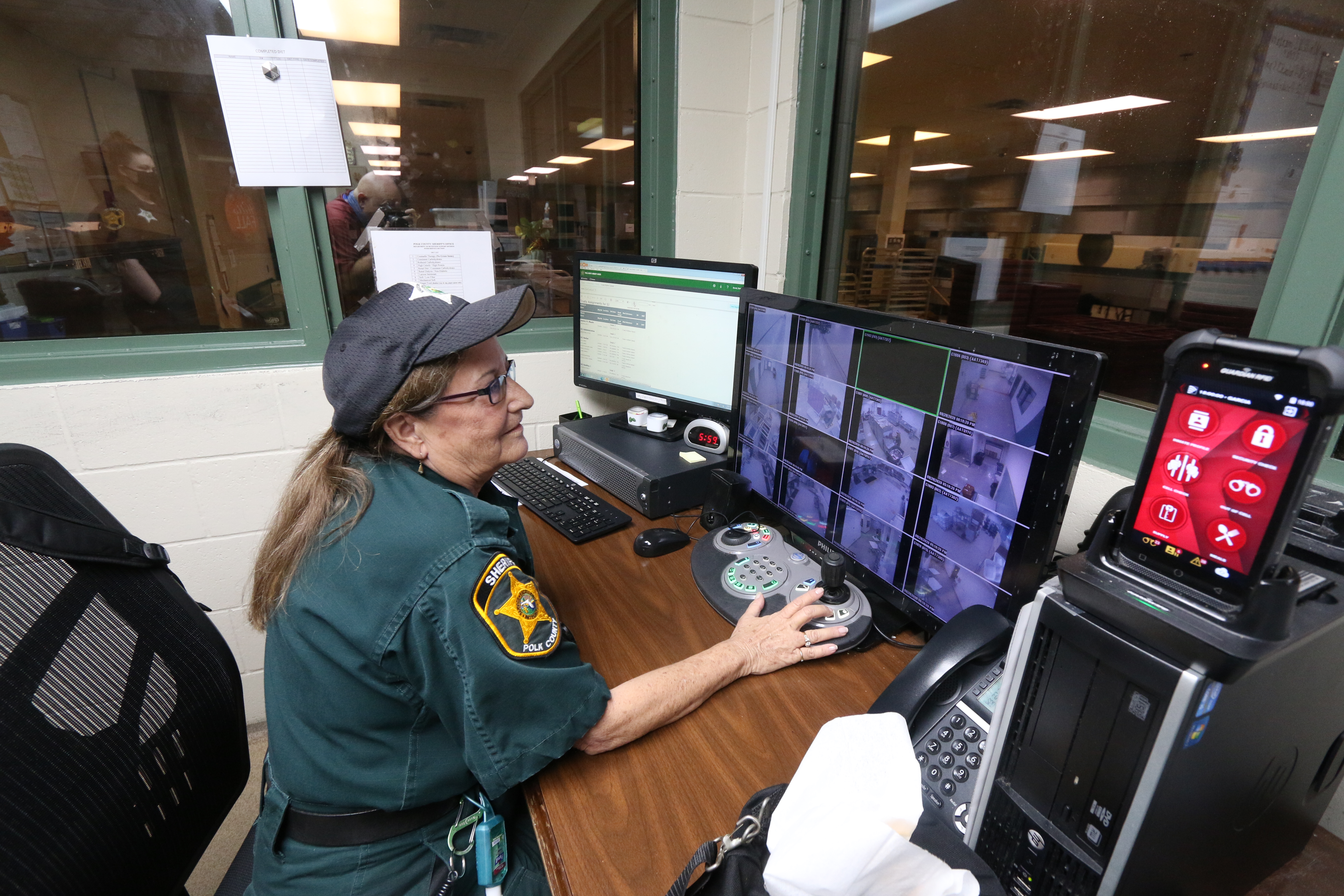Detention deputy monitoring inmates